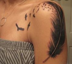 a woman's shoulder with birds and feathers on her left arm, which is covered in black ink