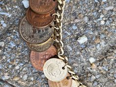 Very unique and interesting bracelet for a coin enthusiast in your life, or maybe a pirate! This 3" closed 6" long open, charm bracelet features a variety of coins from Africa, Mexico and other potential places. Coins vary in size and color, all dating from around 1960s. Bracelet itself is a chain link and is a light gold tone. Clasp is a tab lock and works as it should to open and close. Piece does have surface scratches here and there as it is an other set of coins. Please look at images closely. Location: Box# Baltimore 1960s Bracelet, Coin Charm Bracelet, Chesapeake Va, Charm Bracelets, Baltimore, Chain Link, 1960s, Jewelry Bracelets, Gold Tones