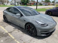 a silver car parked in a parking lot