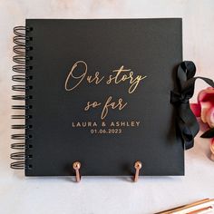 a black notebook with gold writing on it