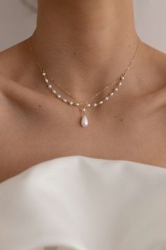 The Aurelia Pearl Necklace is handcrafted with 14k gold-filled chain and freshwater pearls to create a unique necklace embodying elegance and charm. Preorder 7-10 days send out. Packaged in an elegant plastic-free reusable jewelry box, this necklace makes the perfect gift or special treat for oneself. Note: This intricate necklace can tangle even with our utmost care in sending, please be gentle and patient to untangle and place in the right position after wearing. *14k gold-filled chain and com Cheap Pearl Necklace With Delicate Chain, Luxury Dainty Necklaces With Pearl Chain, Cheap Pearl Jewelry With Delicate Chain, Luxury Dainty Pearl Chain Jewelry, Luxury Delicate Pearl Necklace With Delicate Chain, Luxury Delicate Jewelry With Pearl Drop, Luxury Dainty Gold-plated Pearl Necklace, Cheap Pearl Drop Necklace As Gift, Luxury Minimalist Pearl Necklace With Delicate Chain