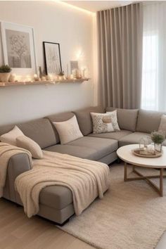 a living room filled with lots of furniture next to a white table and window covered in curtains