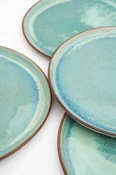 three blue plates sitting on top of each other