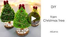 three small christmas trees sitting on top of each other in front of a white background