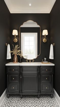 a black and white bathroom with gold accents