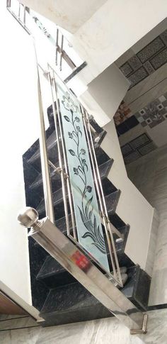 a stair case with decorative glass panels on it