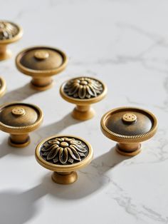 These French Aged Brass Cabinet Knobs are the perfect addition to elevate the look of your antique dresser or cabinets. Made from solid brass, these drawer knobs feature a unique rope design around the edge of the top, adding a touch of elegance to any piece of furniture. The top of each knob also showcases a beautiful flower pattern, giving them a vintage and sophisticated charm. Highlights: - Solid brass construction for durability and longevity - Rope design around the edge of the top - Flower pattern on the top for added style Usage: These antique dresser knobs are perfect for use on cabinets, dressers, drawers, and other furniture pieces. Simply replace your existing knobs with these French Aged Brass Cabinet Knobs to instantly transform the look and feel of your space. Quality Assura Brass Cabinet Knobs, Brass Cabinet Hardware, Wine Grapes, Brass Knob, Brass Cabinet Knob, Brass Cabinet, Dresser Knobs, Rope Design, Aged Brass