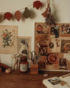 there are many pictures hanging on the wall next to each other, including leaves and honey jars