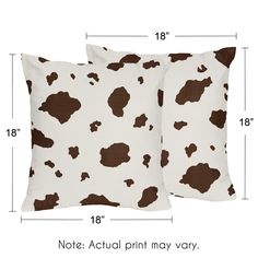 two brown and white cow print pillows with measurements