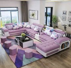 a living room filled with lots of purple furniture