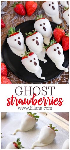 chocolate covered strawberries with ghost faces and strawberries in the background, on a black plate