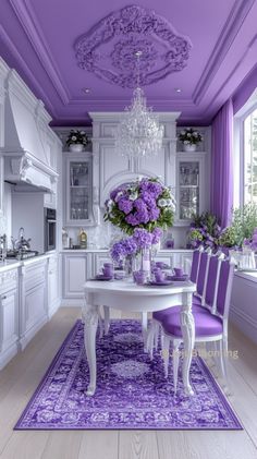 a dining room with purple chairs and a white table in the middle of the room