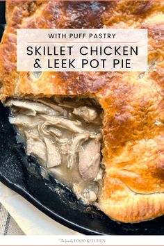 a skillet chicken and leek pot pie with puff pastry in the middle on a plate