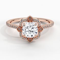 a rose gold engagement ring with diamonds on the band