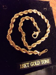 "Classic design rope bracelet is made with an 18kt gold tone finish and measures 7\" in length x 1/8\" wide. Lobster claw clasp which holds securely. Bracelet has original packaging and was made in Korea. Excellent condition and does not appear to have ever been worn." Gold Rope Chain Bracelet, Classic Gold Bracelets With Rope Chain, Adjustable Gold Rope Chain Bracelet, 14k Gold Rope Chain Bracelet Gift, Gold Braided Bracelet With Lobster Clasp As Gift, Bracelet Rope, Vintage Madame Alexander Dolls, Rhinestone Jewelry Set, Design Bracelet