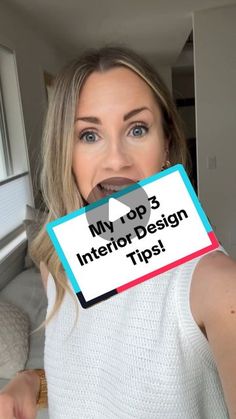 a woman holding up a sign with the words my top 3 interior design tips on it