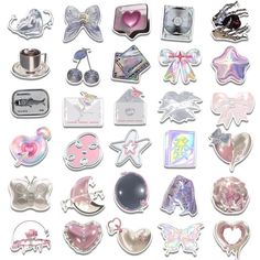 many different types of stickers and magnets on a white surface, including heart shaped objects