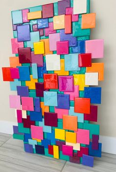 a multicolored piece of art that looks like it is made out of colored blocks