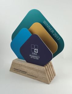 four business cards stacked on top of each other in front of a wooden stand with the word, club pharmacy center