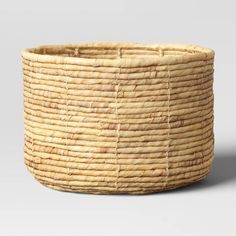 a woven basket is shown on a white background