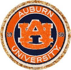 the auburn university logo on an orange and blue sequinized patch with gold glitters