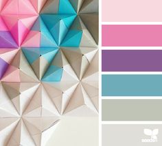 the color scheme is pink, blue, and grey with an origami background