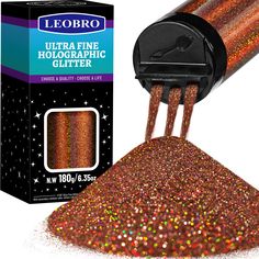 a close up of a glitter powder in front of a box