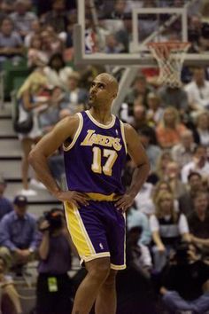 a basketball player is standing on the court