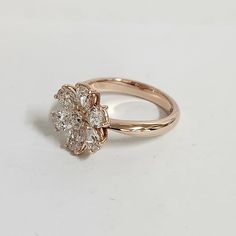 a gold ring with three diamonds on it