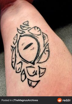 a tattoo on the leg of a person with a clock in it's center