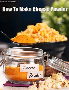 a spoon full of cheese powder on top of a table