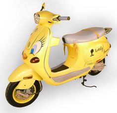 a yellow scooter with an image of a dog painted on the front and side