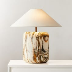 a marble lamp sitting on top of a white table