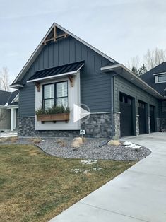 a gray house with white trim and black shutters