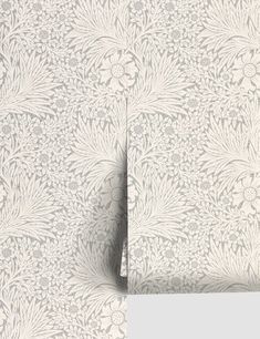 the wallpaper is white and has an intricate design