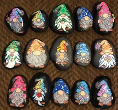 a group of painted rocks sitting on top of a carpet