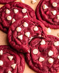 red velvet cookies with white chocolate chips and marshmallows arranged on a table