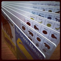 a stack of brown bear books sitting on top of a wooden table next to each other