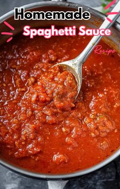 homemade spaghetti sauce in a pot with a spoon