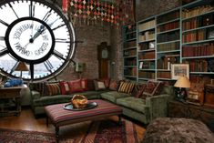 a living room filled with furniture and a large clock