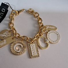 New With Tags Gold-Tone Charm Bracelet Featuring Enamel And Rhinestone Charms Lobster Clasp Guess Jewelry, Favorite Purse, Gold Charm Bracelet, Bracelet Chain, Enamel Charms, Workout Accessories, Gold Charm, Charm Bracelets, Dream Wardrobe