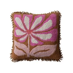 a pink and brown pillow with fringes on it