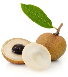 an open kiwi fruit next to a cut in half one with a green leaf on top