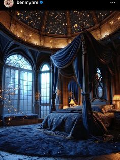 a bedroom with a canopy bed and lots of lights on the ceiling is decorated in blue