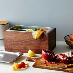 a cutting board with some fruit on it