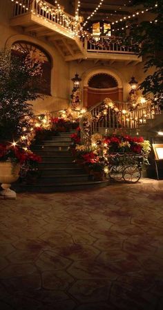 a staircase with christmas lights and decorations on it