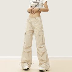 5ft 4''(163cm) tall, 97 lbs(44kg) weight and wearing a size M - Wide straight fit- Adjustable waist- Side pocket- 2 colors Beige Full-length Parachute Pants For Streetwear, Sporty Beige Pants With Pockets, Beige High Waist Parachute Pants For Streetwear, Khaki Full-length Bottoms For Streetwear, Full Length Khaki Bottoms For Streetwear, Khaki Full Length Bottoms For Streetwear, High Waist Beige Parachute Pants For Streetwear, Beige High-waist Parachute Pants For Streetwear, Fitted Beige Pants For Streetwear