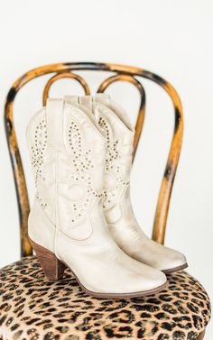 Bring the spirit of the Wild West into the modern era with these crisp champagne cowboy boots. Perfect for festivals, nights out, or even a quick line dance in the living room—because why not? Details Chic western inspired boot Faux leather upper in a crisp champagne hue with bronze studs Almond toe 3 inch heel height Fit true to size. If between sizes, size up. Brand: Naughty Monkey Colored Boots, 3 Inch Heels, Jewelry Bags, Business Fashion, Western Boots, Shoe Box, Sneaker Boots, Sale Items, Houston