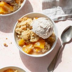 two bowls filled with fruit and ice cream