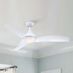 a white ceiling fan in a room